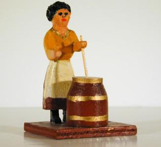 Untitled (woman churning butter - brown churn)