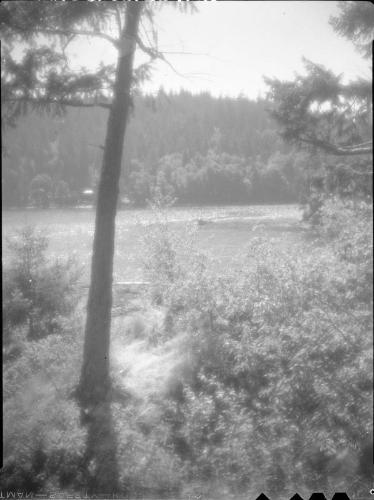Untitled (small boat viewed from shore)
