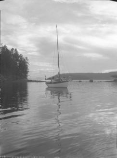 Untitled (sailboat anchored on lake)