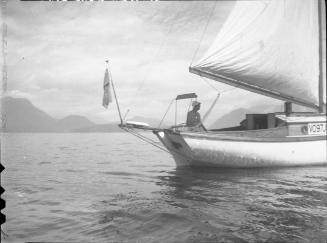 Untitled (man at stern of sailboat)