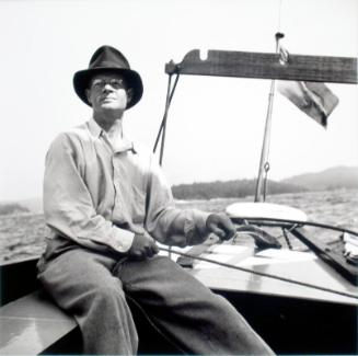 Untitled (L.G. Saunders at tiller of boat)