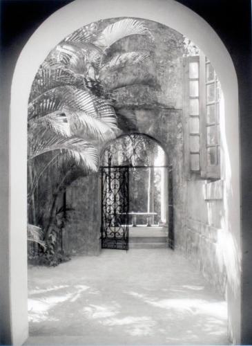 Untitled (tropical courtyard wth arched entrances)