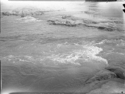 Untitled (rushing water over rocks)