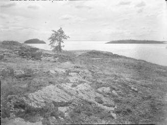 Untitled (rugged lakeshore with distant islands)