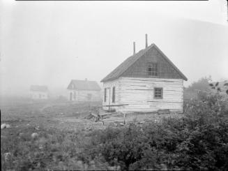 Untitled (three houses on rugged terrain)