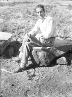 Untitled (man sitting on rock)