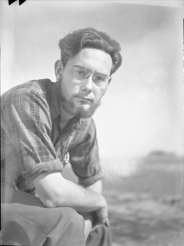 Untitled (man resting elbows on knees)