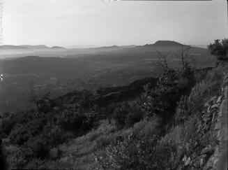 Untitled (cliff over town)