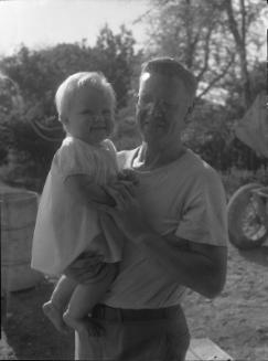 Untitled (man holding baby)