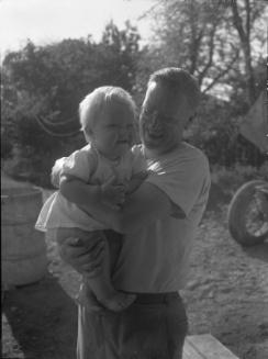 Untitled (man holding baby)