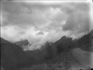 Untitled (car on mountain road)