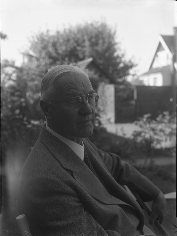 Untitled (elderly man sitting)