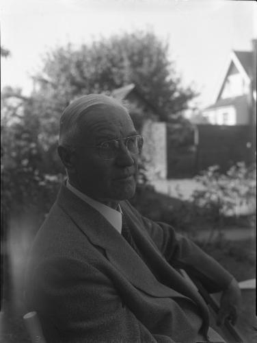 Untitled (elderly man sitting)