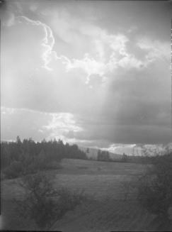 Untitled (field and stormy sky)