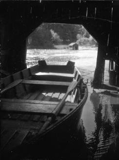 Untitled (rowboat under a bridge)