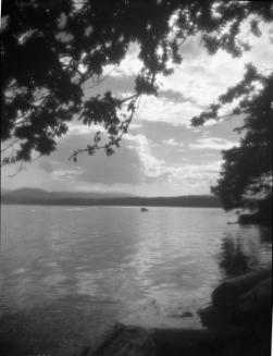 Untitled (boat on lake at night)