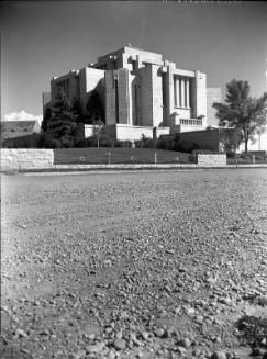 Untitled (stately building on gravel road)