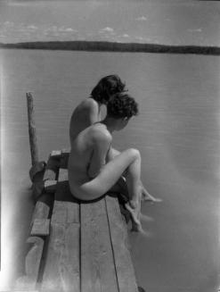 Untitled (nude women sitting on wharf)