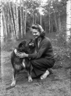 Untitled (young woman embracing dog)