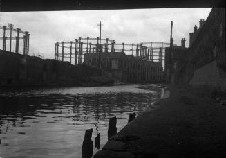 Untitled (canal along warehouse area)