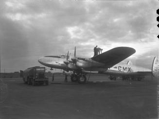 Untitled (airplane being refuelled)