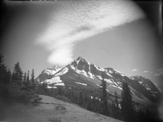 Untitled (wispy clouds over mountains)