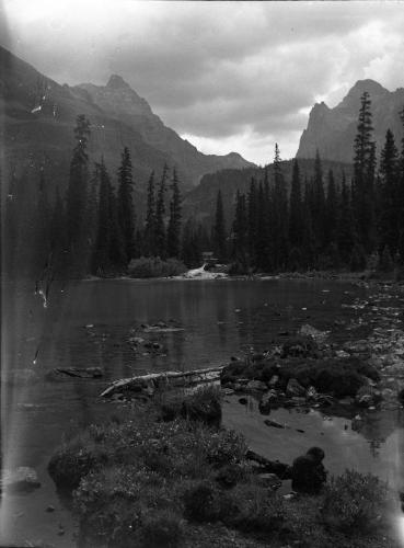 Untitled (lake shore with distant cabin)