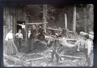 Mattie in the doorway of the cookhouse, Hillman & Beaton’s logging camp, Camborne, BC