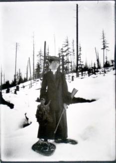 Mattie on snowshoes with some grouse she shot for dinner, Beaton, BC