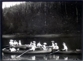 Men and women in canoes and row boats on Upper Arrow Lake (1905)