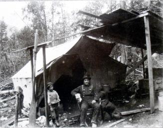 Henry & Bill in front of their first home in Thomson's Landing