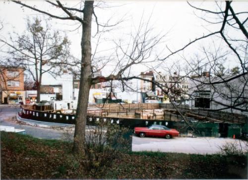 untitled (cityscape with red car)