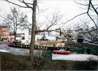 untitled (cityscape with red car)