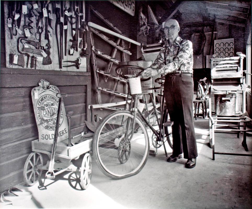 Strasbourg and District Museum, Herb Hey Models a Bicycle Built in 1901. It Was Built with the Steering Wheel, 1981