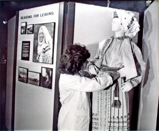 Ukranian Museum of Canada, Janet Prebushewski Adjusts Clothing Display