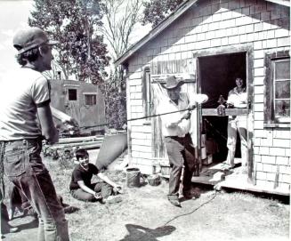 Wood Mountain Rodeo Ranch Museum, Andrew Caragota and his Grandson Rick demonstrate rope making on the museum grounds, 1981