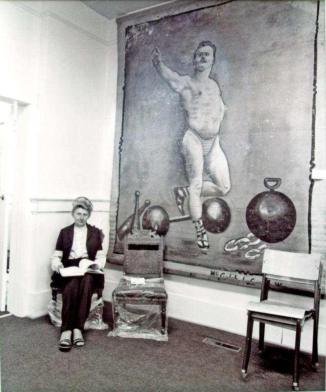 Brita Perdue with canvas hanging, Watson and district Heritage Museum, Watson, 1981