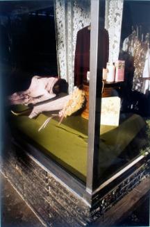display window showing women's clothing, lotions, etc.