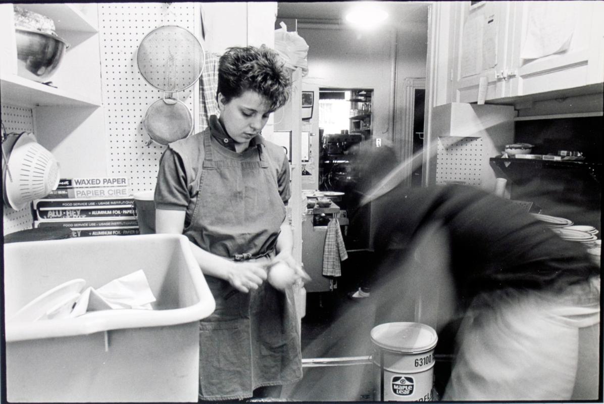 Woman peeling vegetables