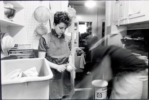 Woman peeling vegetables