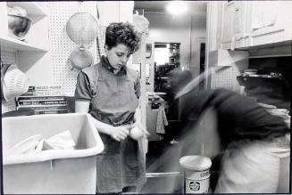 Woman peeling vegetables