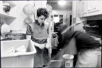 Woman peeling vegetables