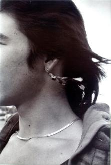 Clinton Bird wearing an earring that he made