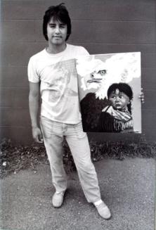 Alex Halkett with one of his paintings