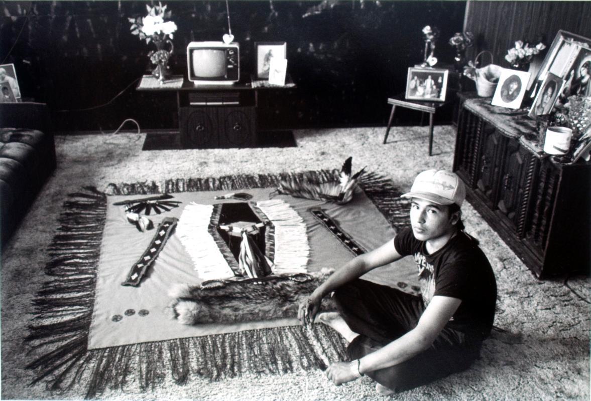 Brian Bird at home showing the outfit he is making for pow wow dancing
