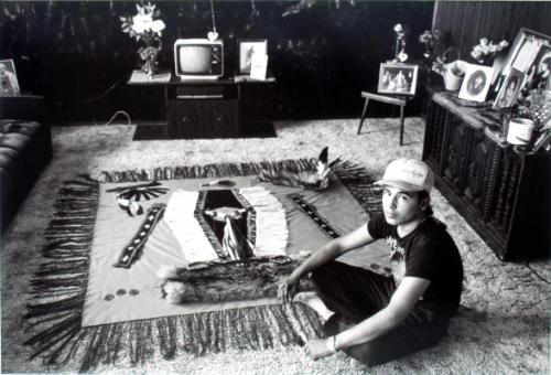 Brian Bird at home showing the outfit he is making for pow wow dancing