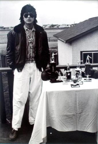 Gerald Haineault with his boxing trophies