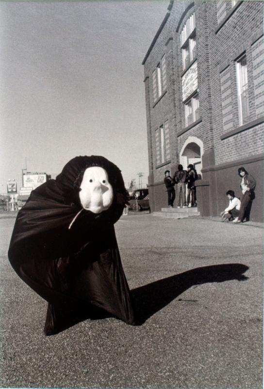 Gloria Neapetung in mask and body bag used for drama practice