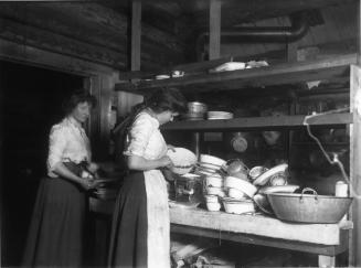 Anne and Rose Williams washing dishes, Nettie L. mine, Ferguson, BC