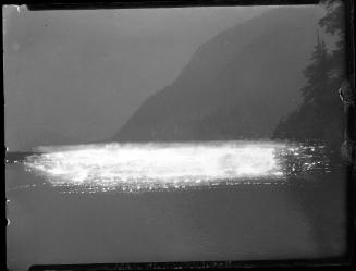Untitled (lake with treed mountains)
